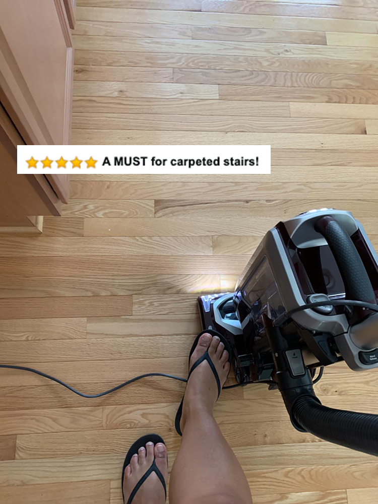 vacuum on hardwood that says a must for carpeted stairs