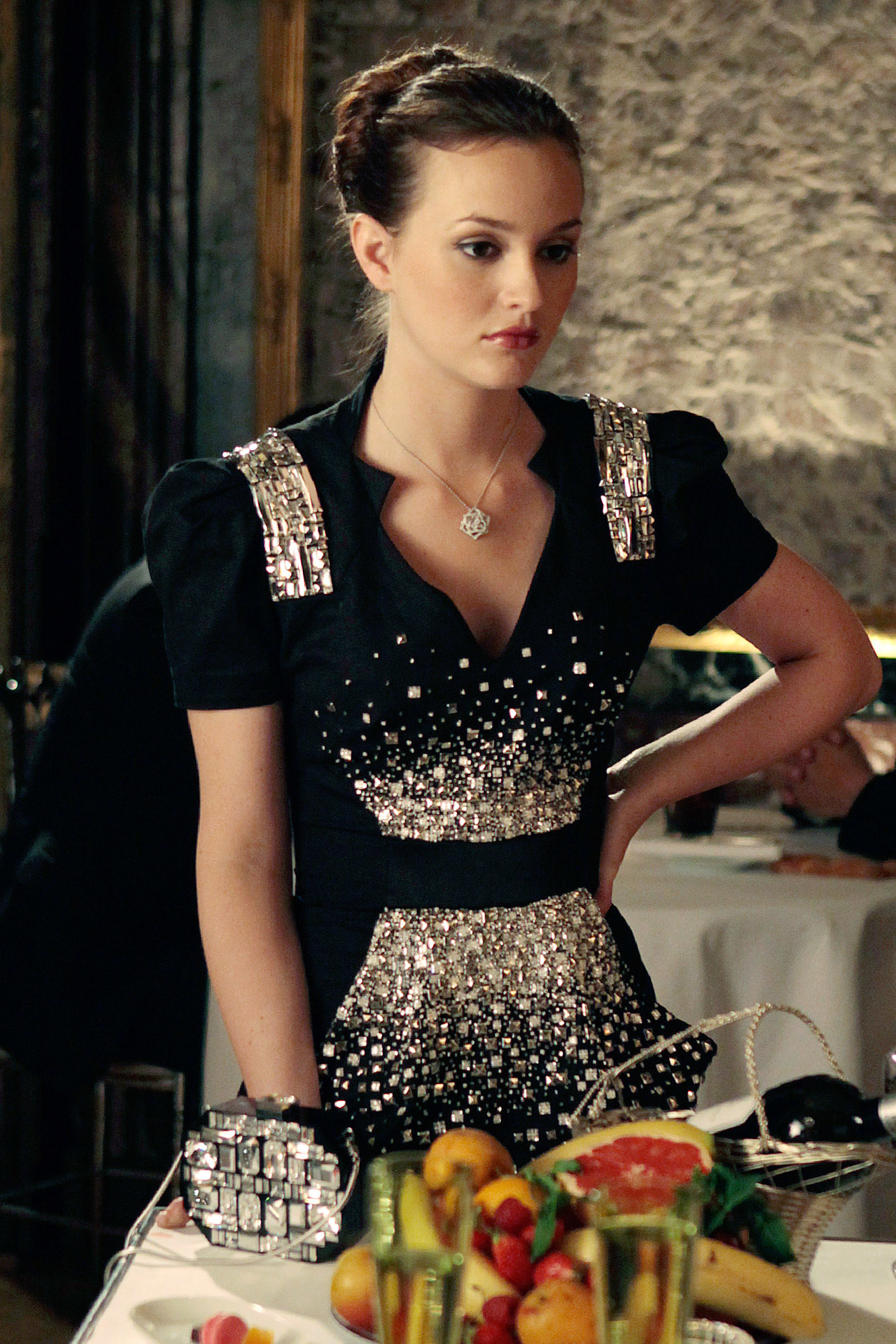 Blair in a shoulder pad short sleeve short dress with a collar and deep v neck and a belt, with sequins up the front and on the shoulders