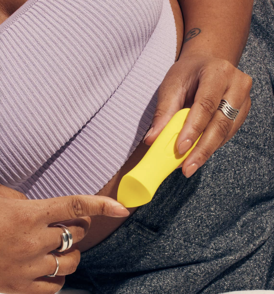 Model holding yellow vibrator