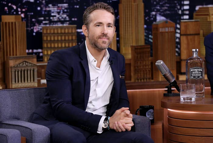 Actor Ryan Reynolds sits on a couch during an interview on "The Tonight Show Starring Jimmy Fallon"