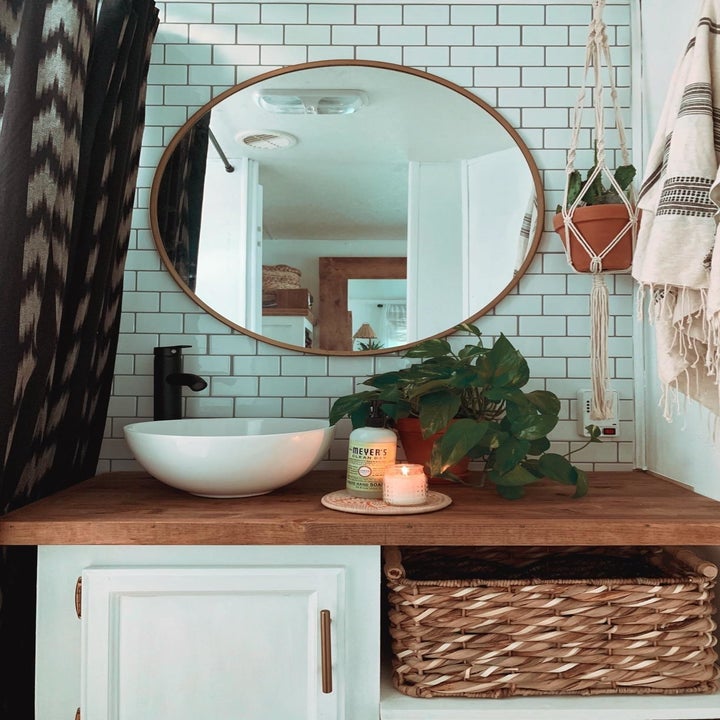 the removable tile backsplash in white on a bathroom wall behind a sink 