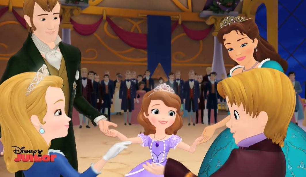 Sophia from Sophia the First stands with her family in a ballroom