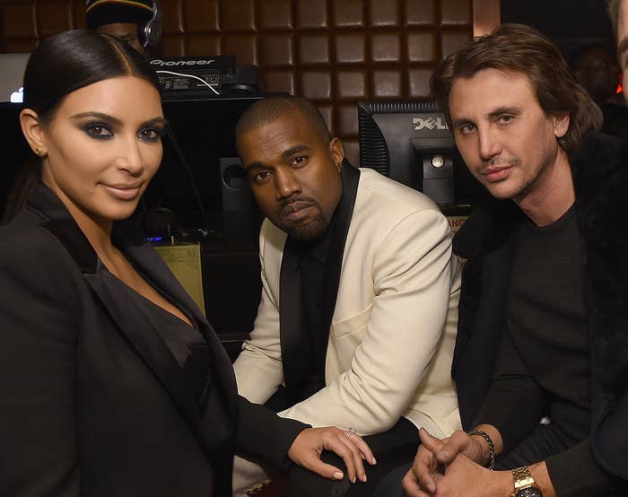Kim and Kanye sit next to Jonathan at a club