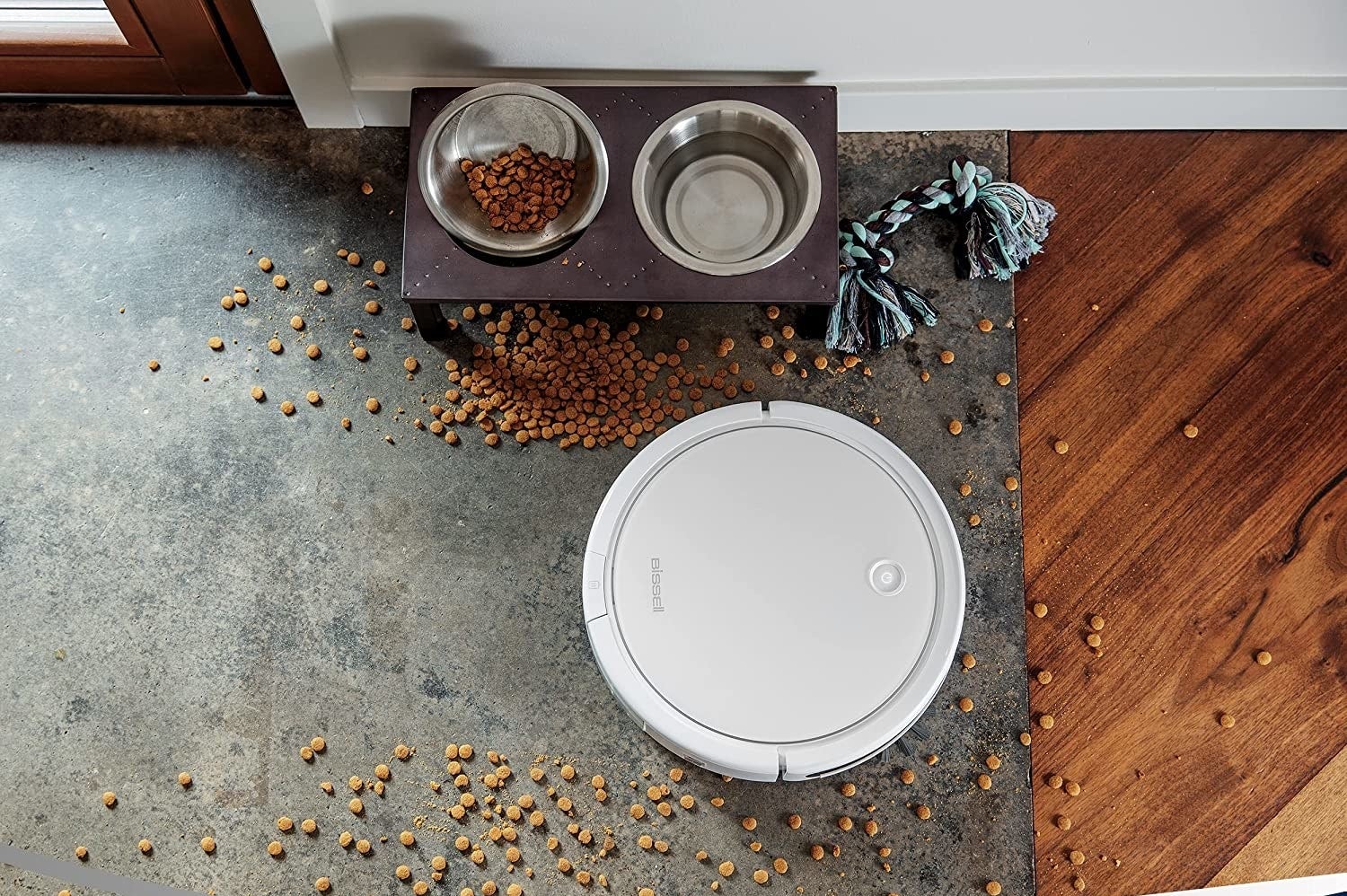 Bissell SpinWave vacuuming up dog food on carpet