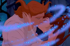 belle kissing the beast as he transforms into prince adam