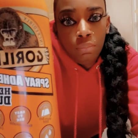 Tessica Brown holds up a bottle of Gorilla Glue spray in a still from the viral video