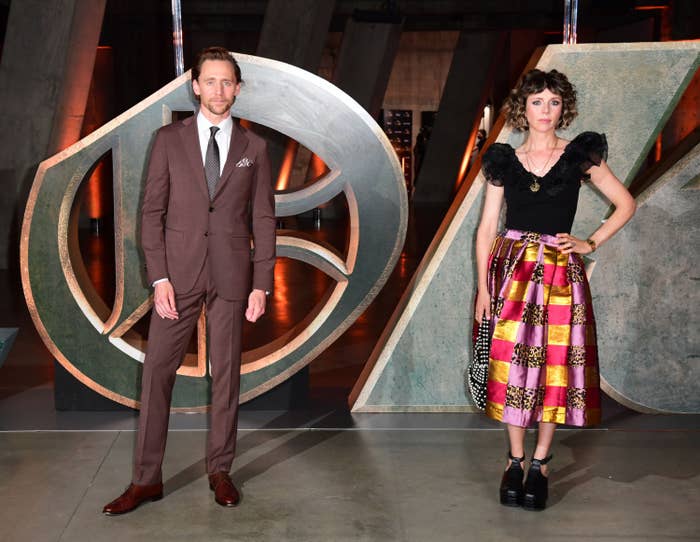 Tom Hiddleston and Sophia De Martino stand side-by-side at a &quot;Loki&quot; event
