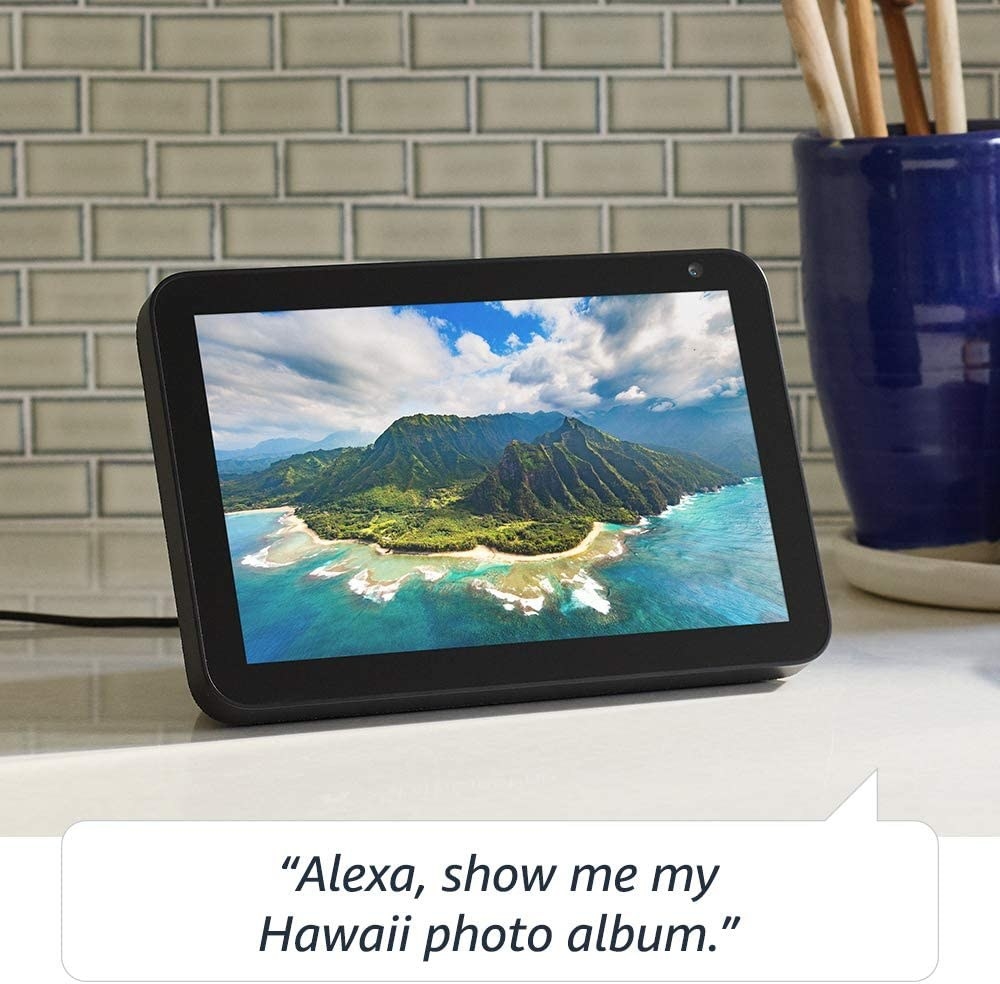 echo show 8 displaying a photo from Hawaii with the words &quot;alexa, show me my hawaii photo album&quot; on the bottom