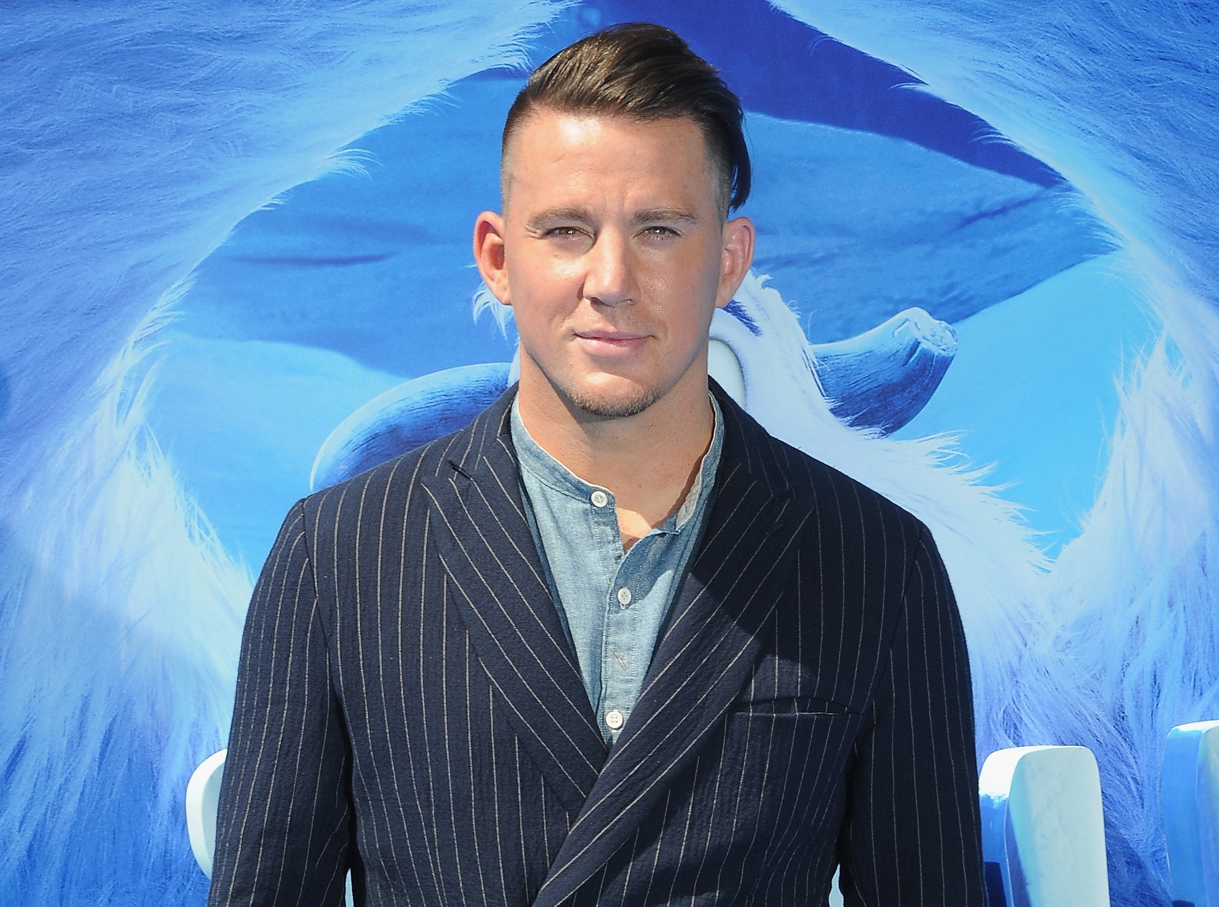 Channing wears a pinstripe suit to an event