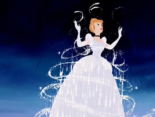Cinderella stands as her raggedy dress turns into a beautiful ball gown