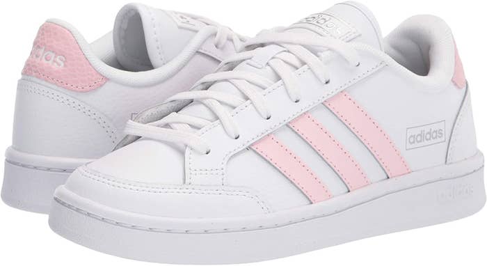 the white sneakers with pink stripes