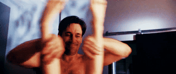 Jon Hamm enthusiastically parting a woman&#x27;s legs