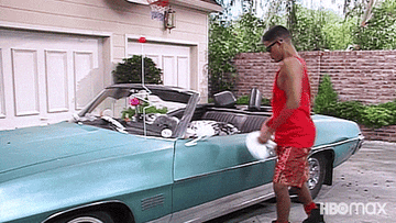 Fresh Prince of Bel Air dancing in front of his car