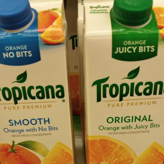 Two boxes of orange juice; the left one says &quot;smooth orange with no bits&quot; and the right one says &quot;original orange with juicy bits&quot;