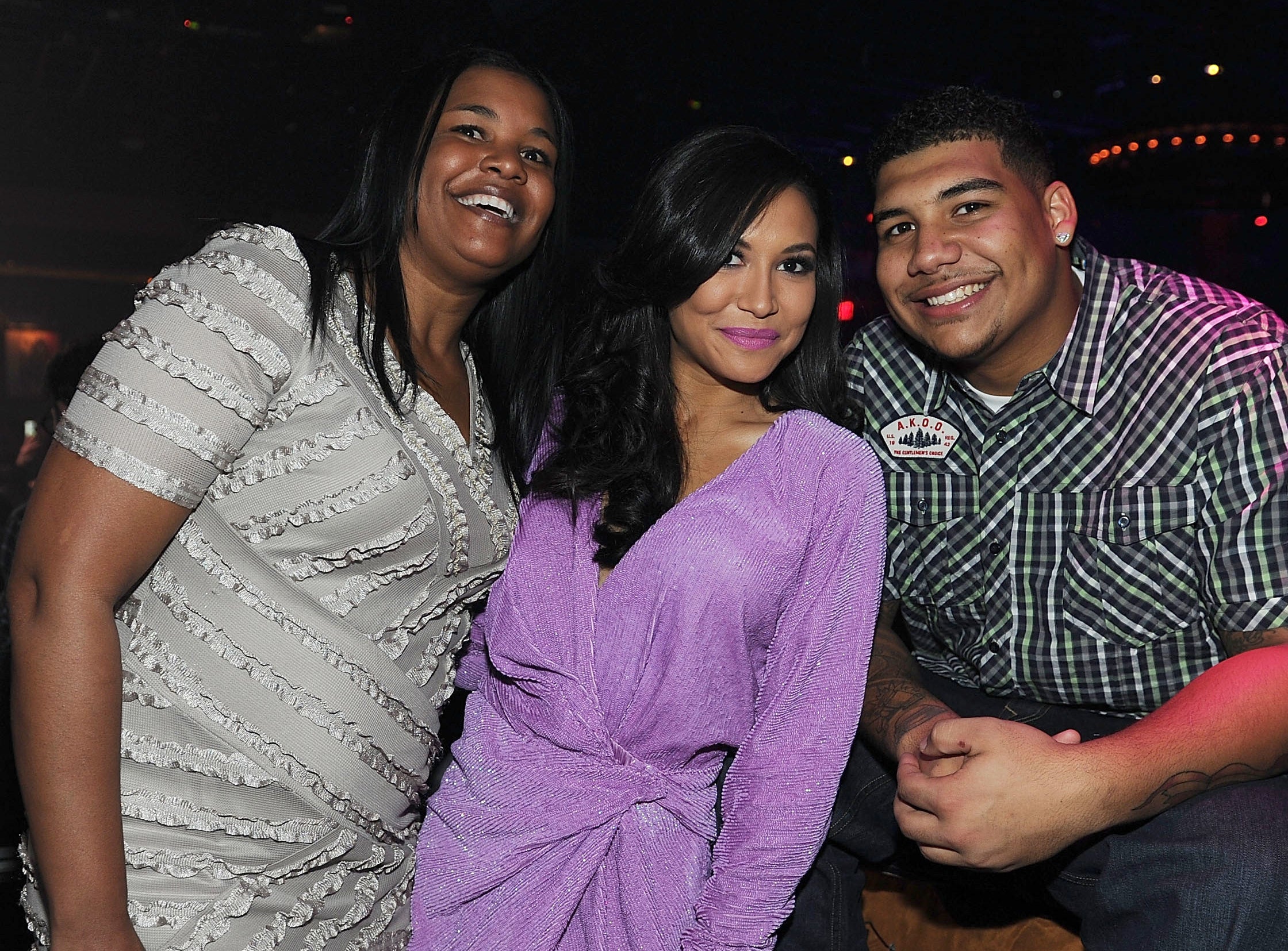 Naya posing with family members at a birthday party