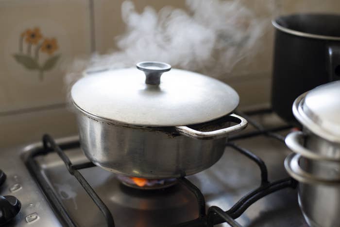 A pot steaming over a heavy flame.