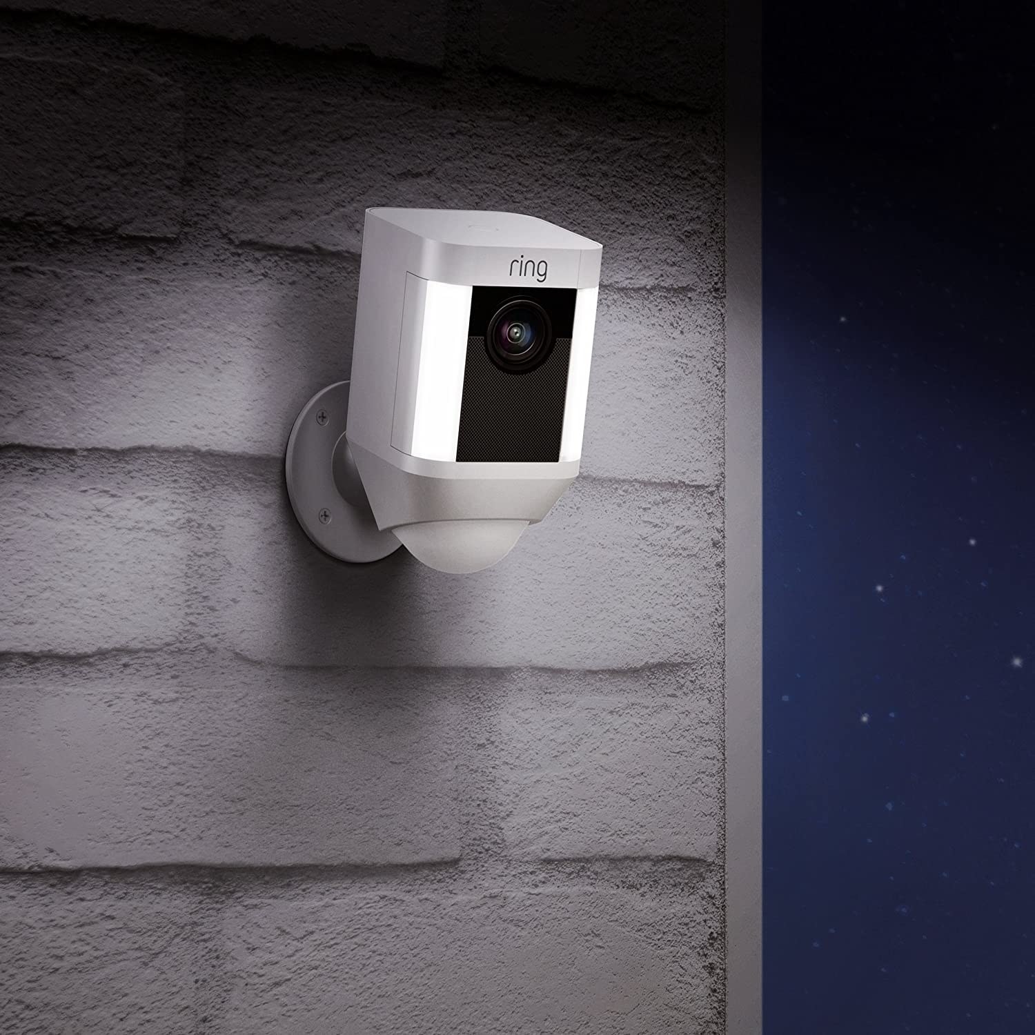 a ring camera mounted on a wall at night