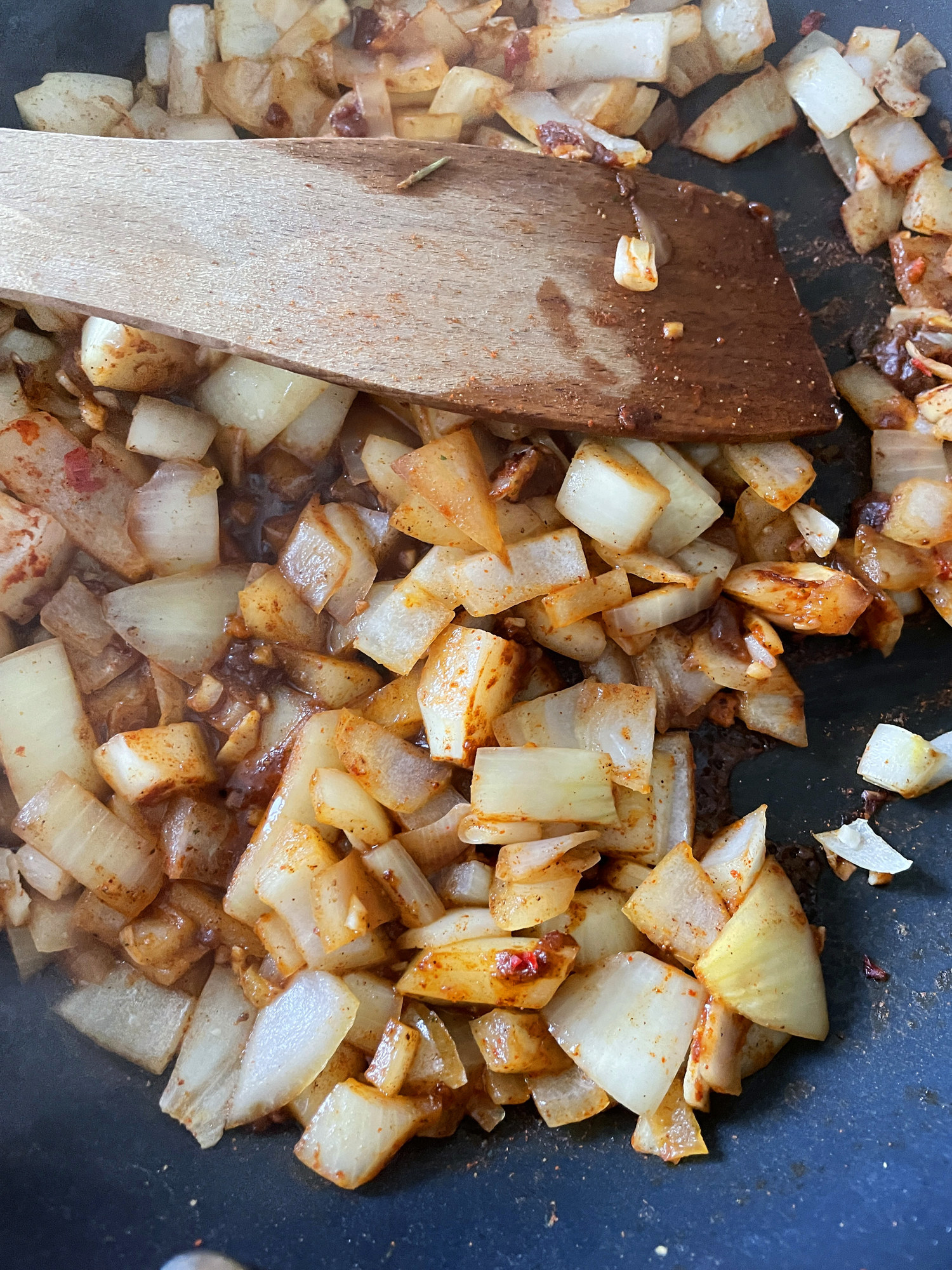 Cooking onions in a non-stick skillet.