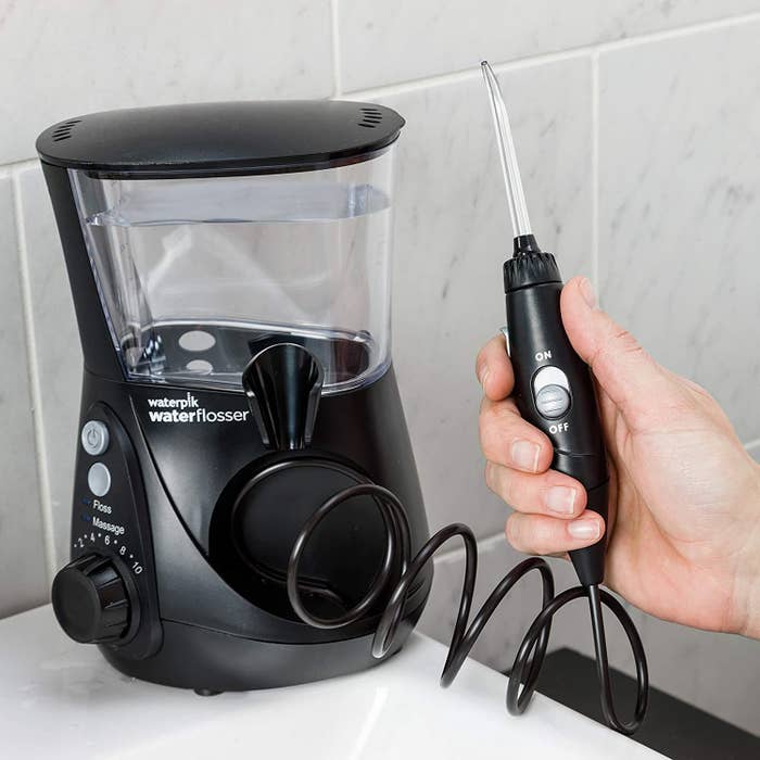 the black Waterpik flosser