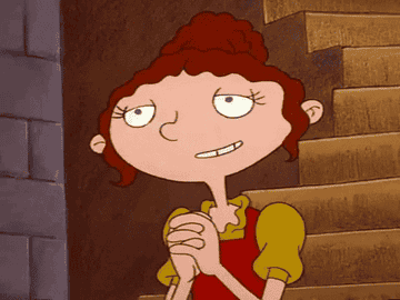 gif of character in Hey Arnold smiling to reveal braces