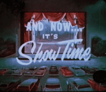 Drive in theater with words &quot;And now...it&#x27;s showtime&quot; on screen 