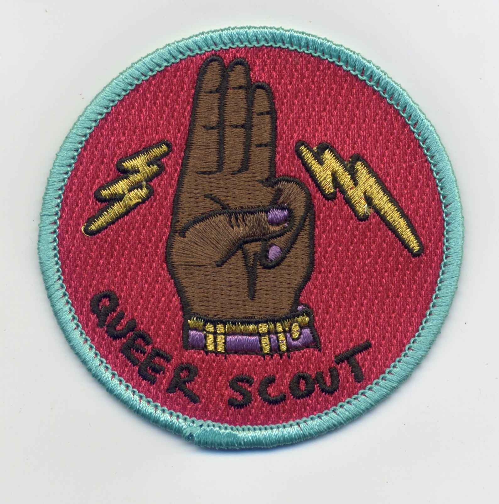 the dark skin queer scout badge