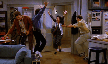The Seinfeld crew dancing excitedly 