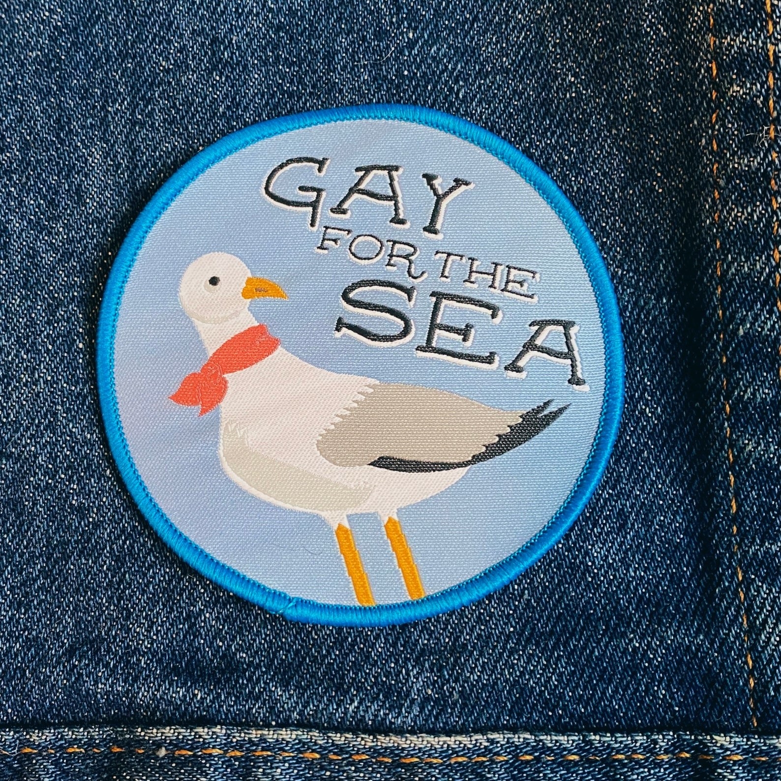 the gay for the sea patch featuring a seagull on a denim jacket