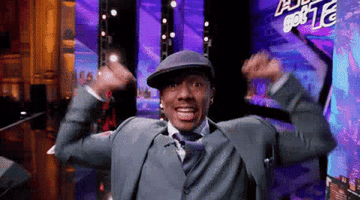 Nick Cannon throws his arms up in the air and cheers on set of &quot;America&#x27;s Got Talent&quot;