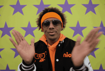 Nick Cannon claps at the 2021 Super Bowl
