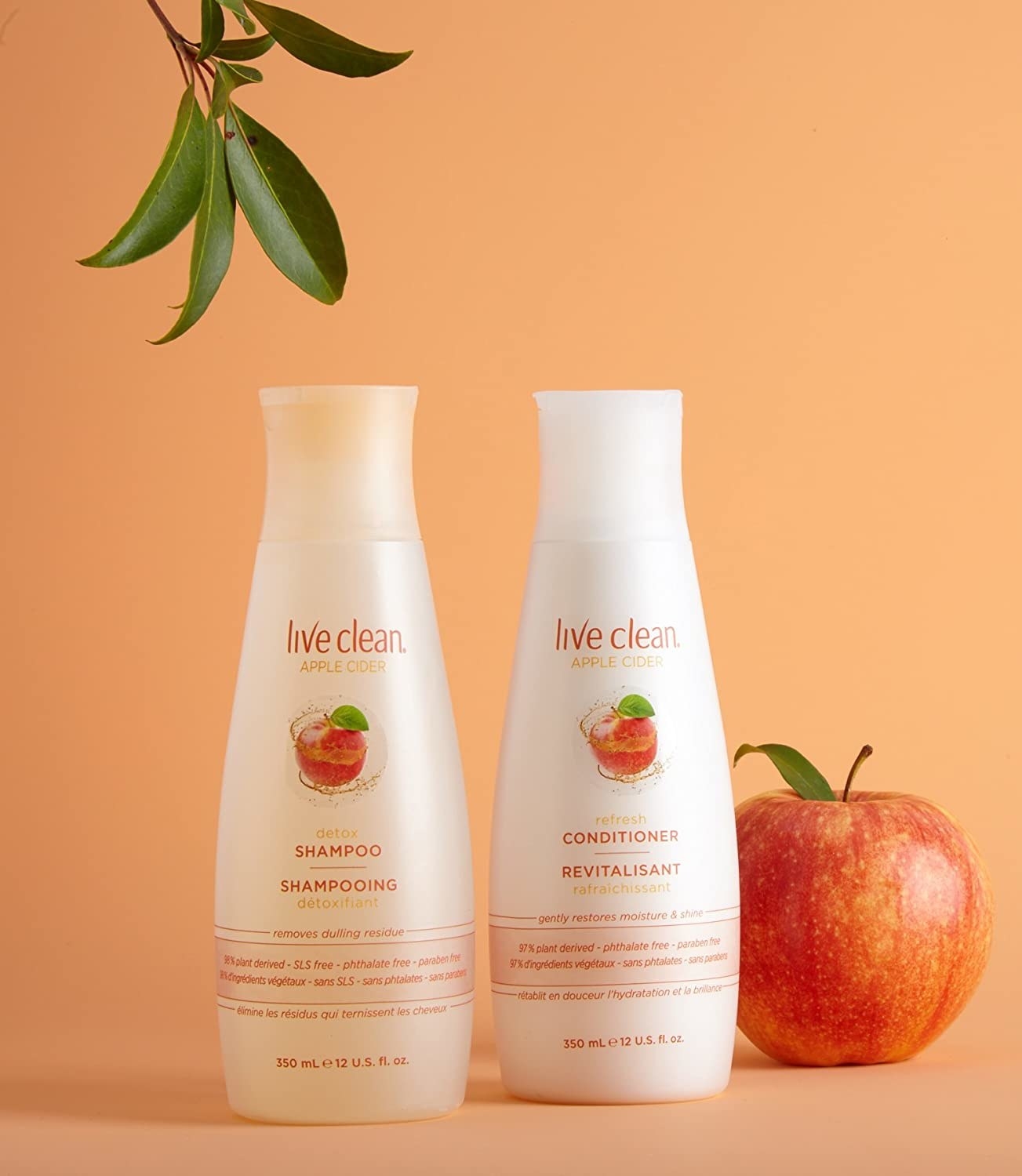 the shampoo and conditioner next to an apple