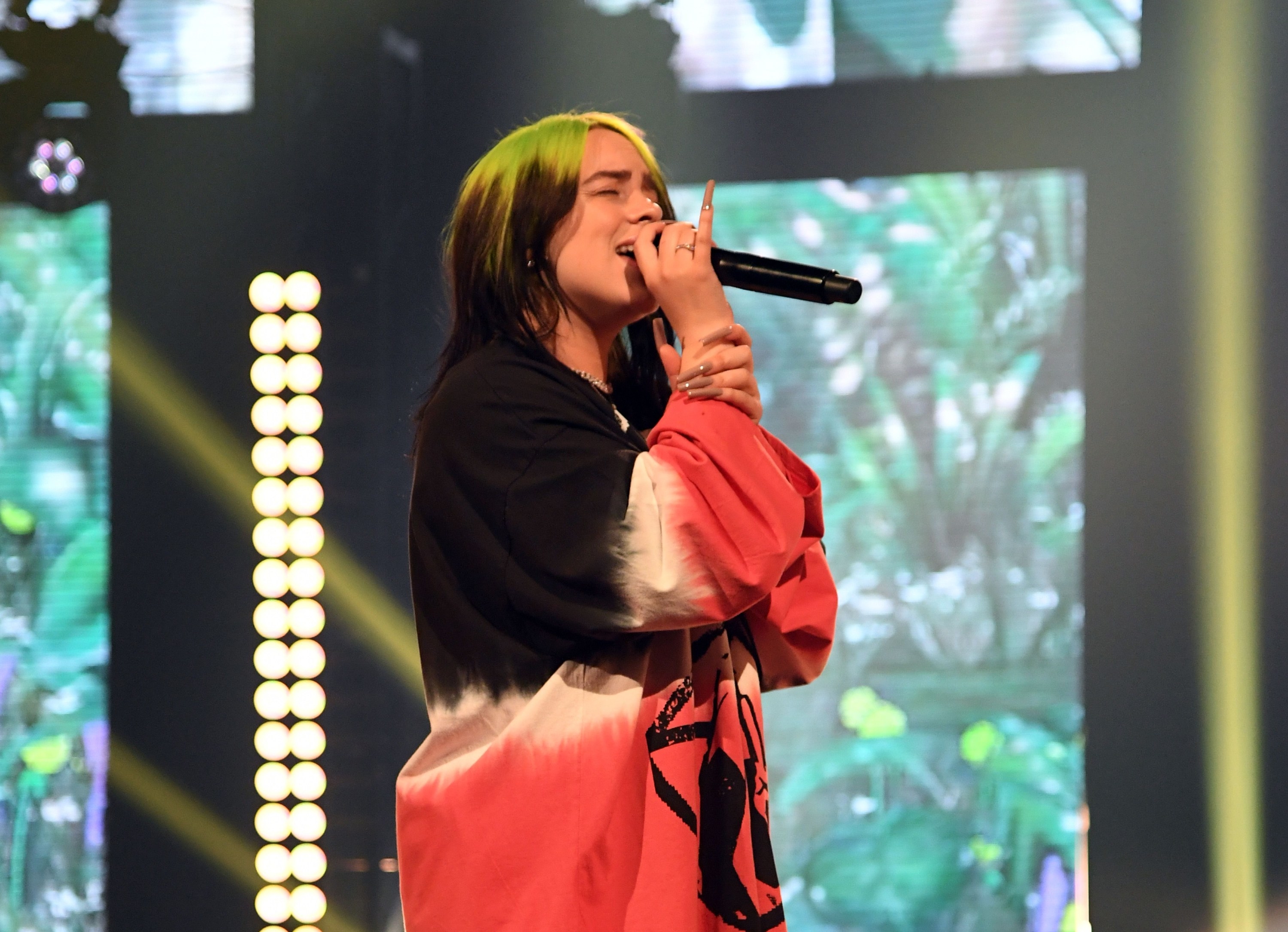 Billie Eilish sings onstage