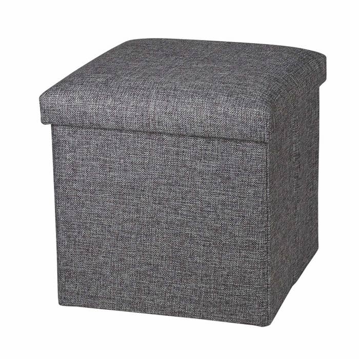 A grey storage ottoman