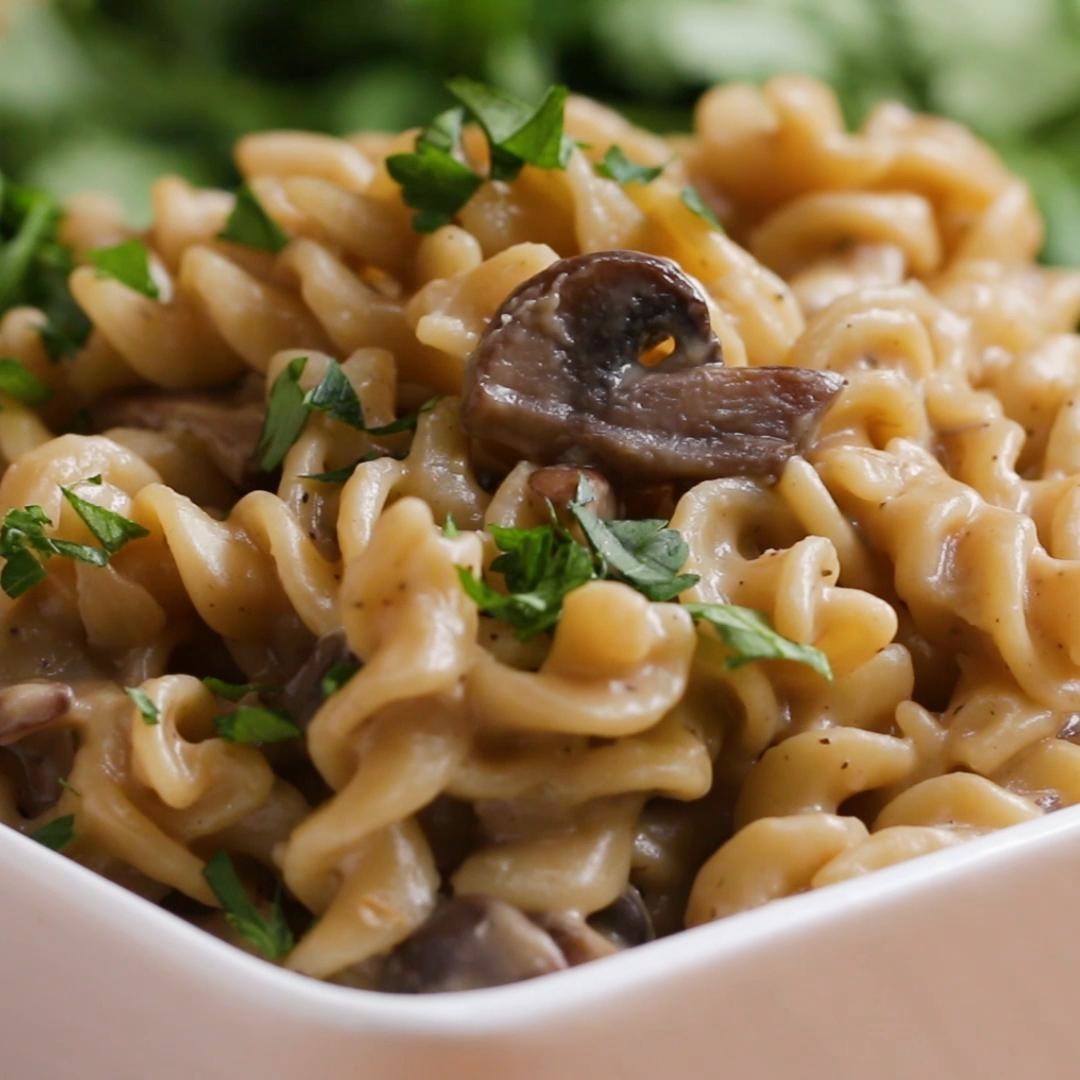 Bowl of mushroom stroganoff topped with parsley
