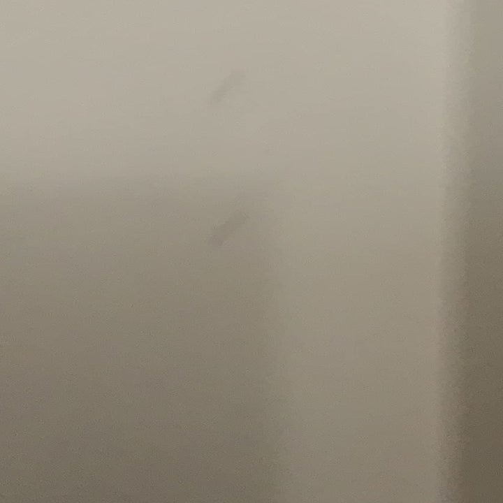 a reviewer photo of the same wall with the holes filled