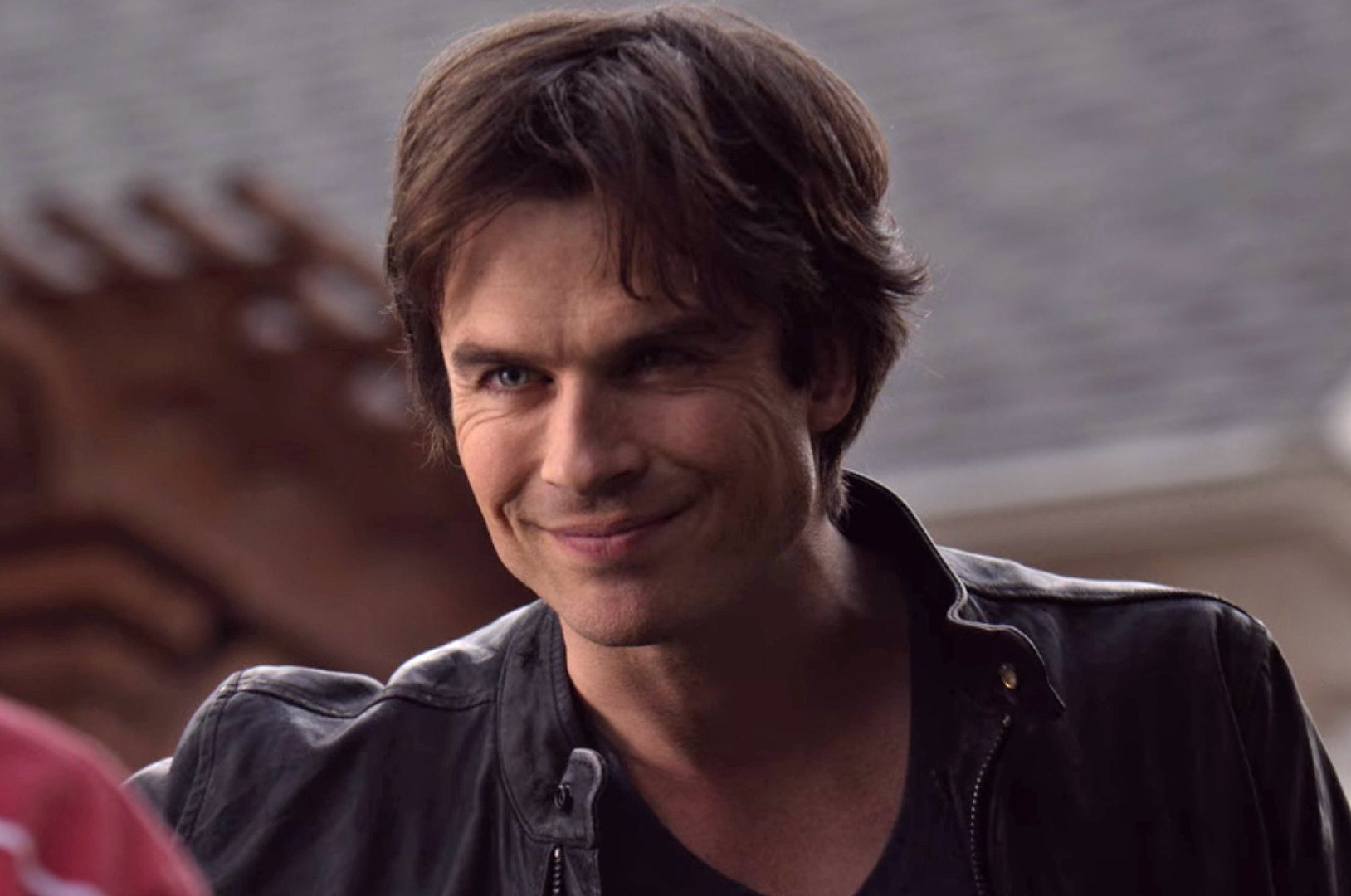 Damon smirking his signature smirk