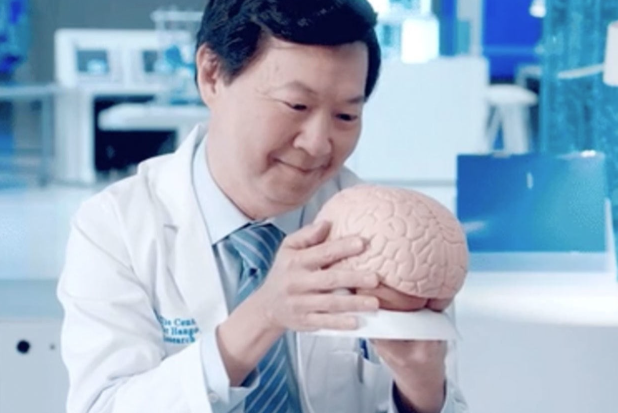 Dr. Ken Jeong looking lovingly at a brain
