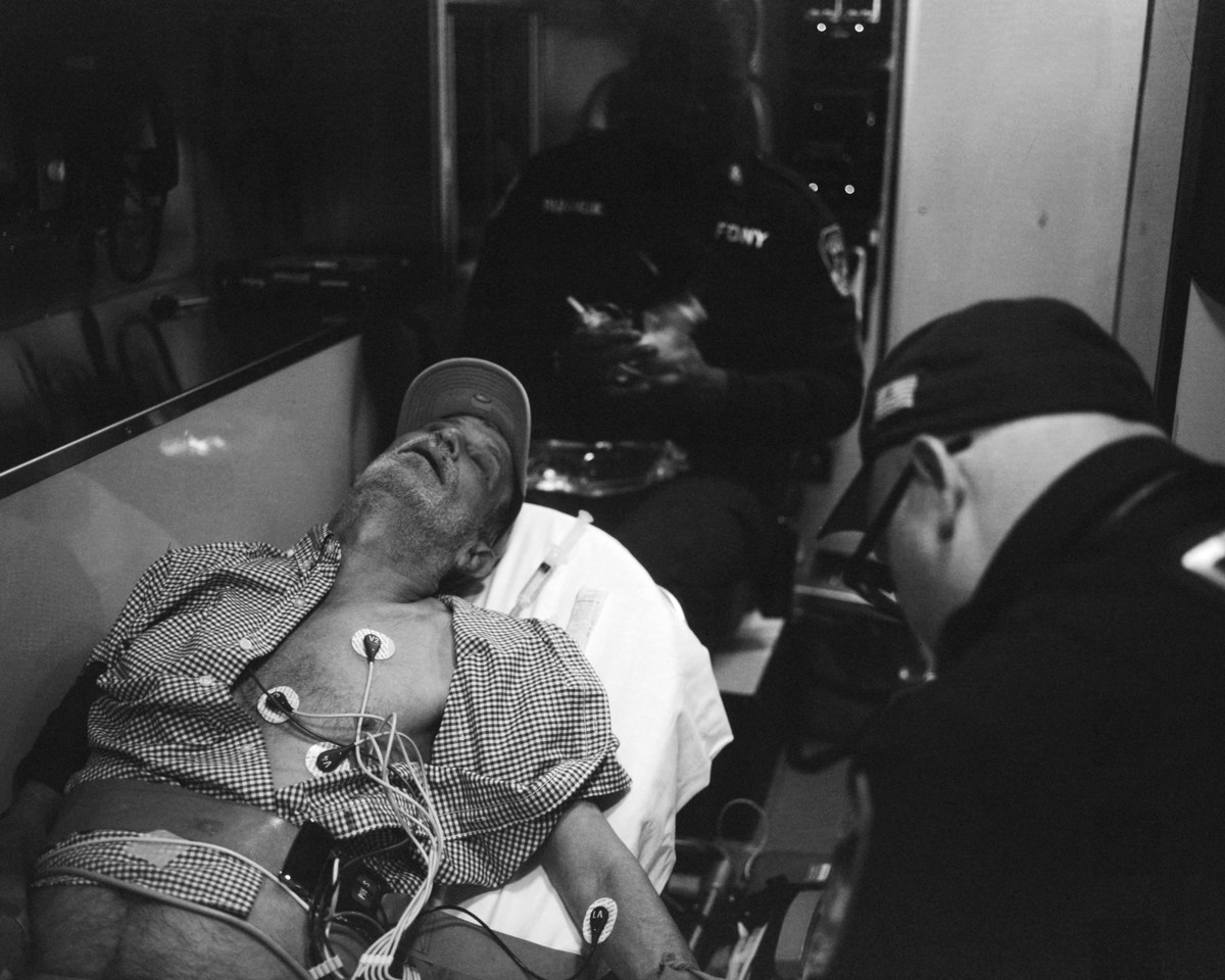 The photographer&#x27;s father looking unconscious in an ambulance 