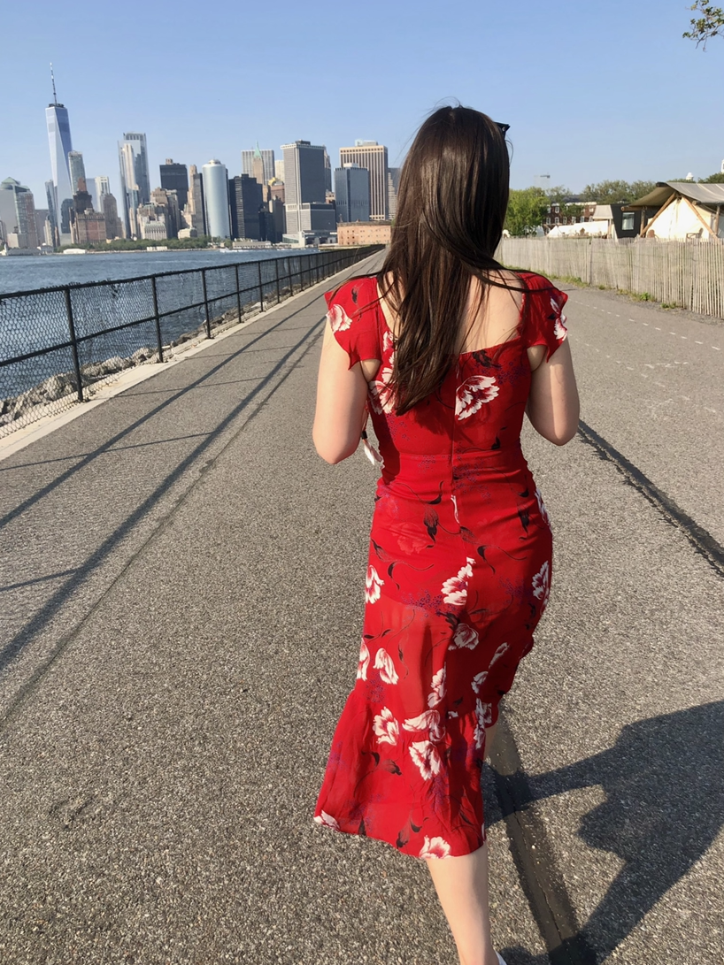 BuzzFeed editor walking toward the Manhattan skyline