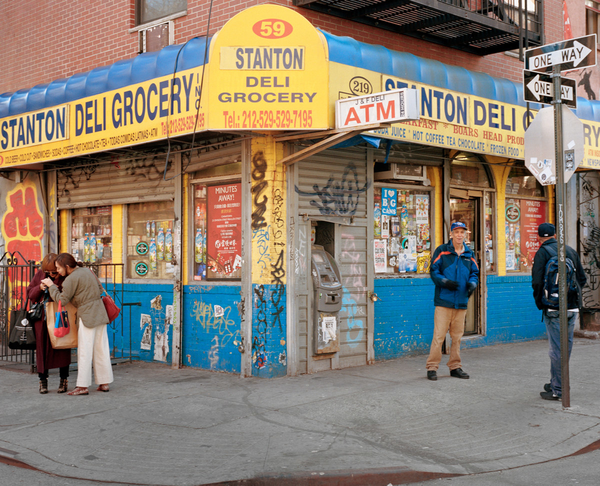 The photographer&#x27;s father standing in front of a bodega in New York City