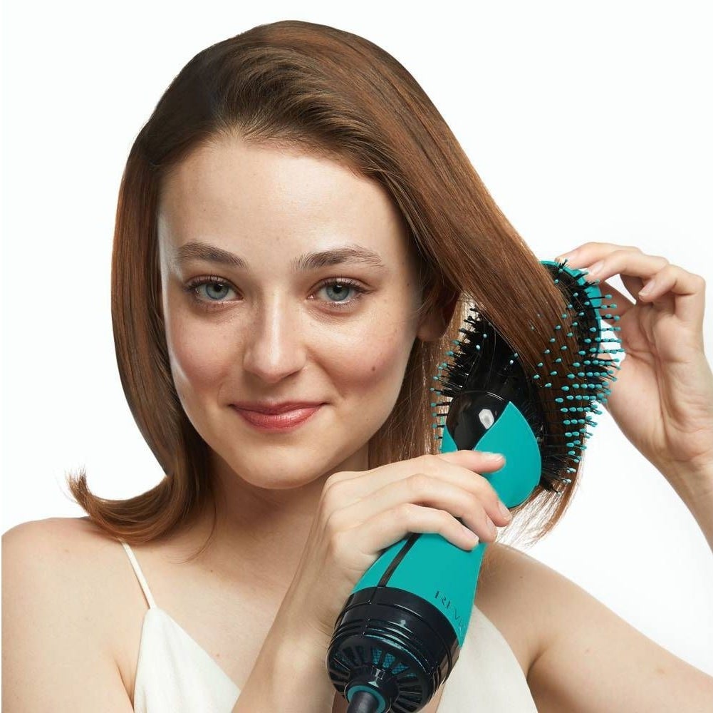 A model uses the product, in teal