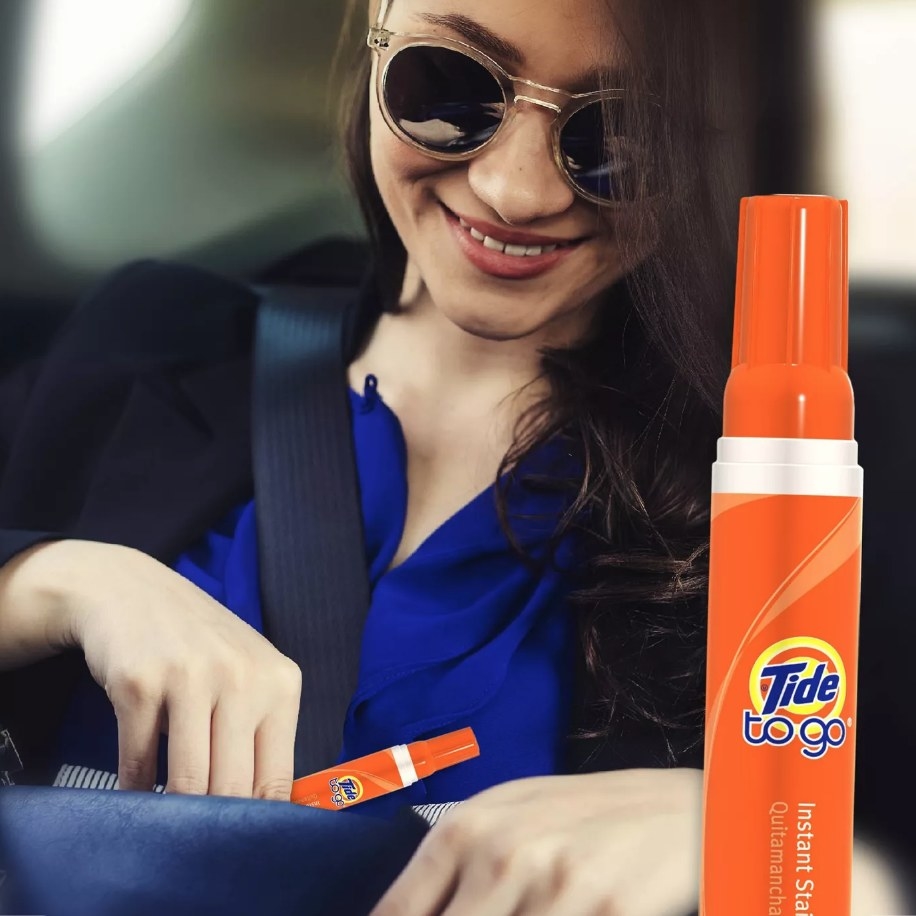 Model using Tide To-Go stick in car 
