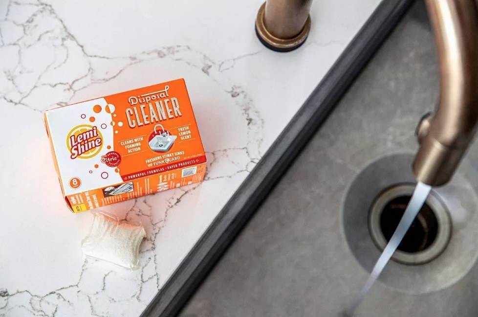 Box of Lemi Shine disposal cleaner next to sink
