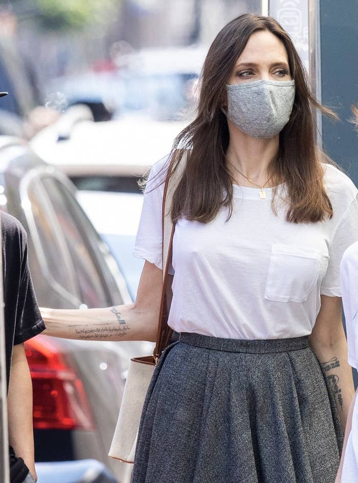 Angelina wears a white tee and grey skirt while out in New York City