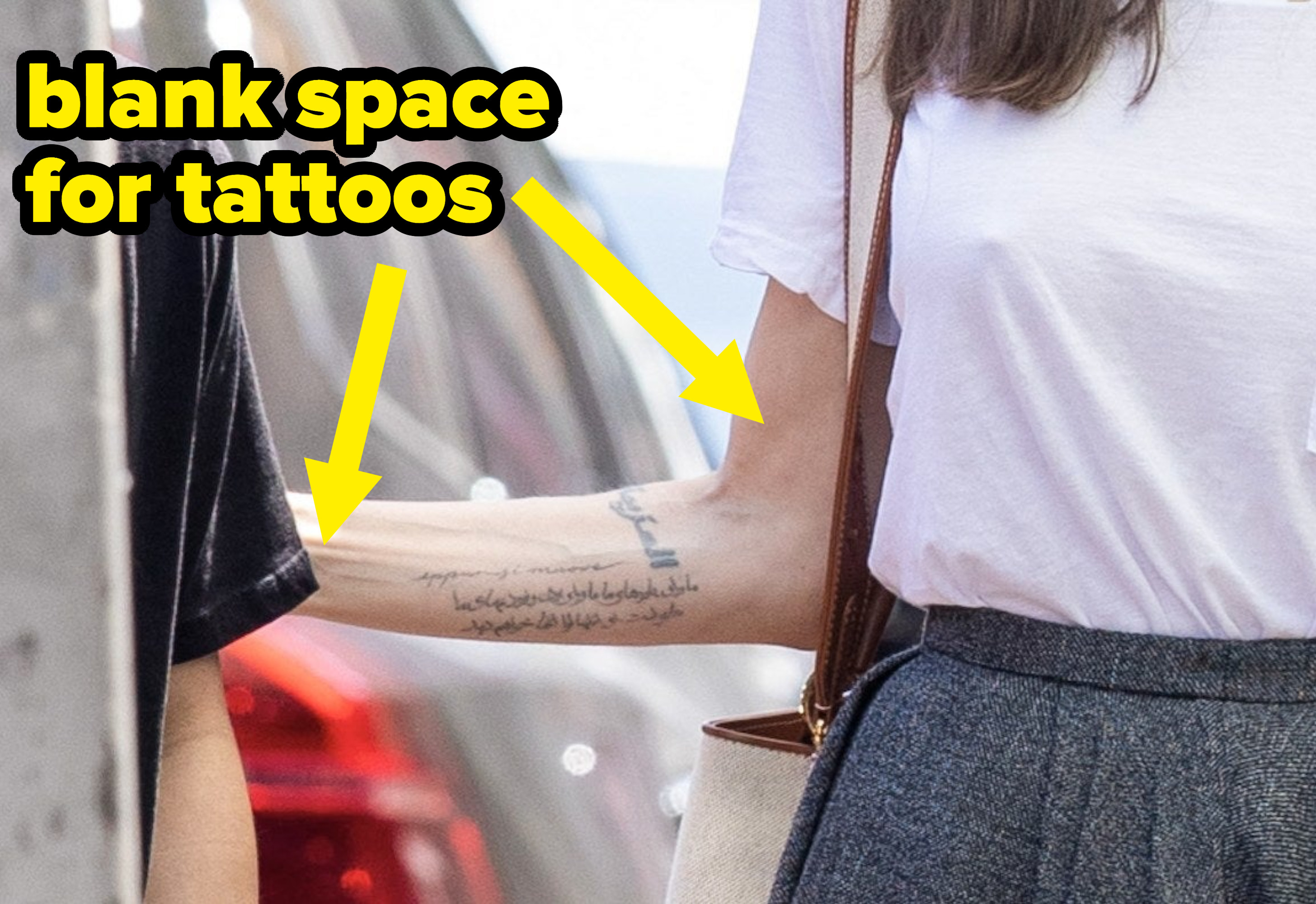 An arrow points out all the other space Angelina has for tattoos on her arms