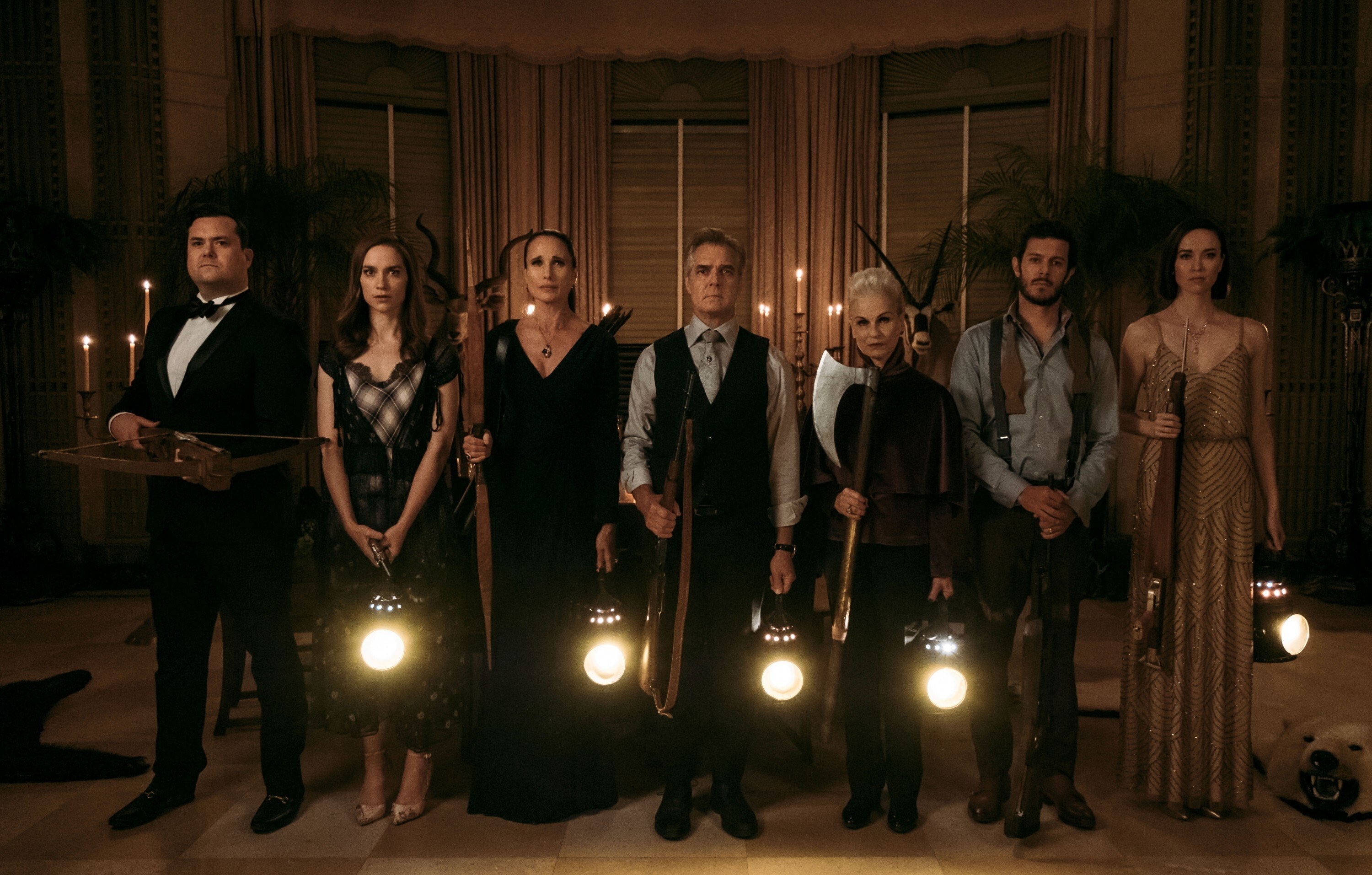 Kristian Bruun, Melanie Scrofano, Andie MacDowell, Henry Czerny, Nicky Guadagni, Adam Brody, and Elyse Levesque with lamps and weapons