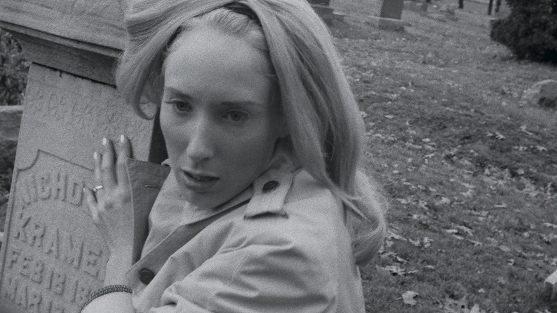 Judith O'Dea clutches a tombstone