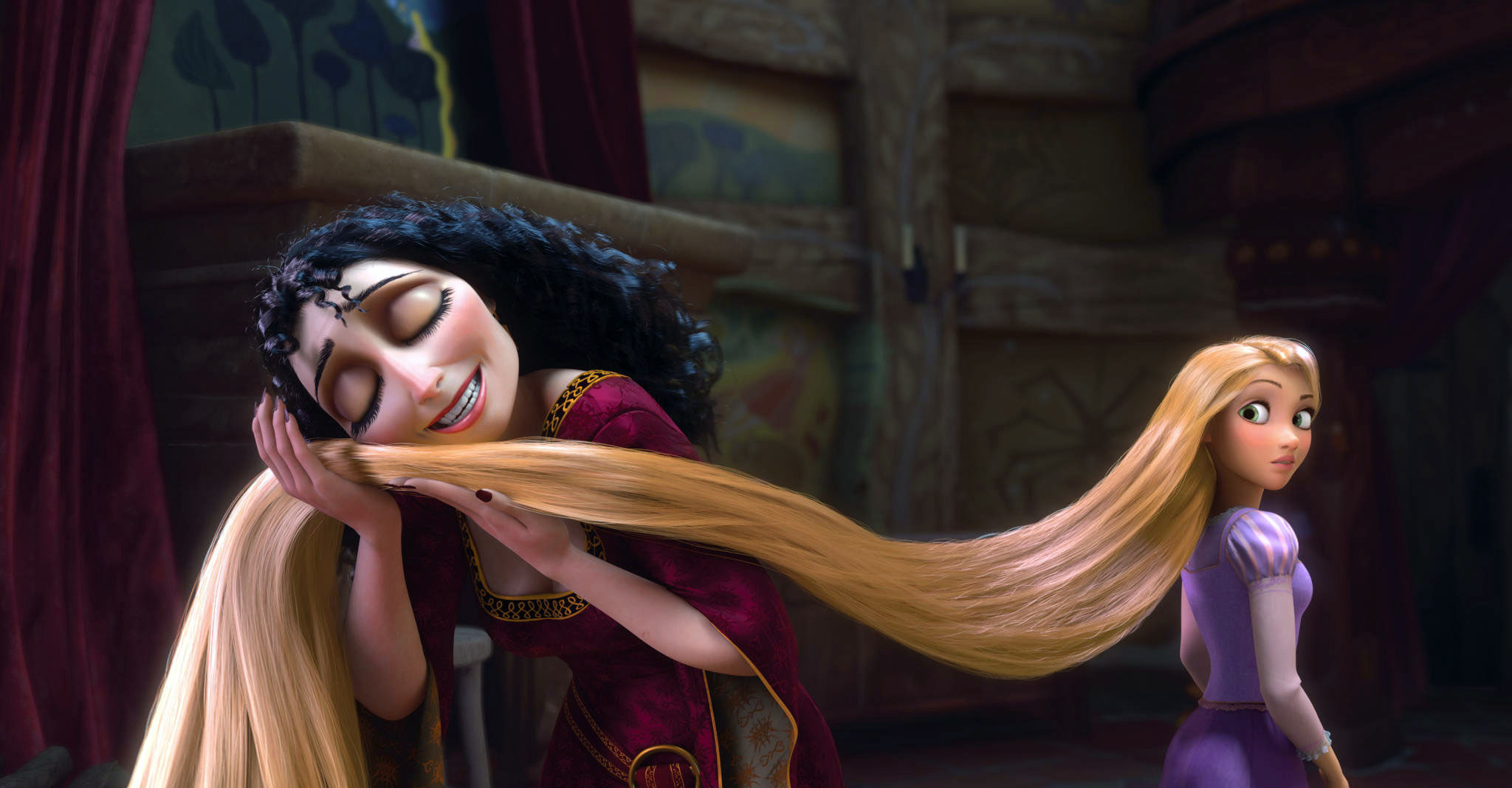 Mother Gothel caressing Rapunzel&#x27;s long blonde hair