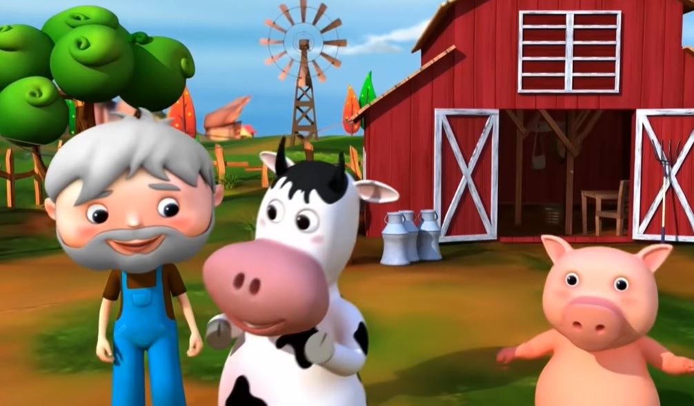 A farmer stands next to a cow and a pig