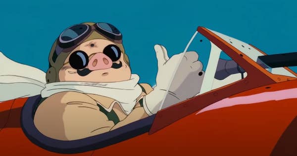 A man with the nose of pig flying a plane